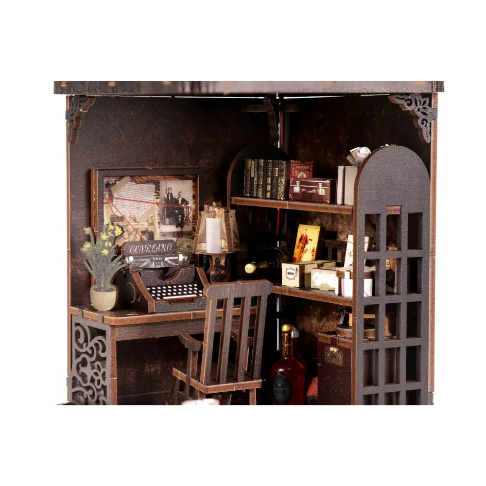 Miniature detective agency book nook with dark wood desk and vintage typewriter