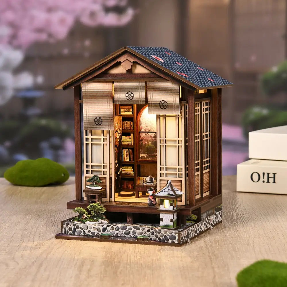 Miniature japanese-style wooden house with dark blue roof and led light in moss-lantern harmony product in australia