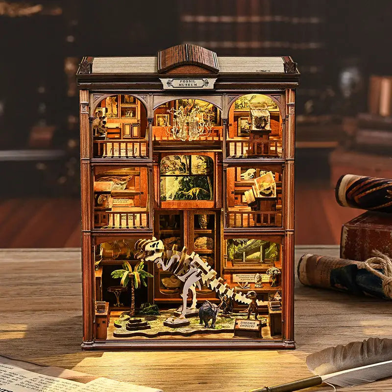Museum of Ancient Wonders book nook with wooden fossil diorama and dinosaur skeleton