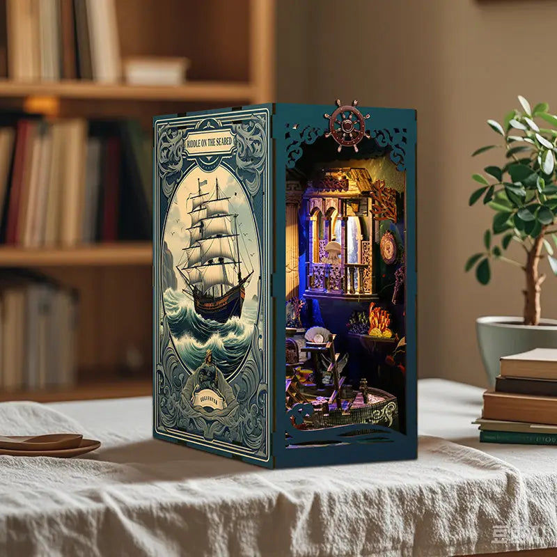 Teal deep sea mystery book nook with sailing ship diorama