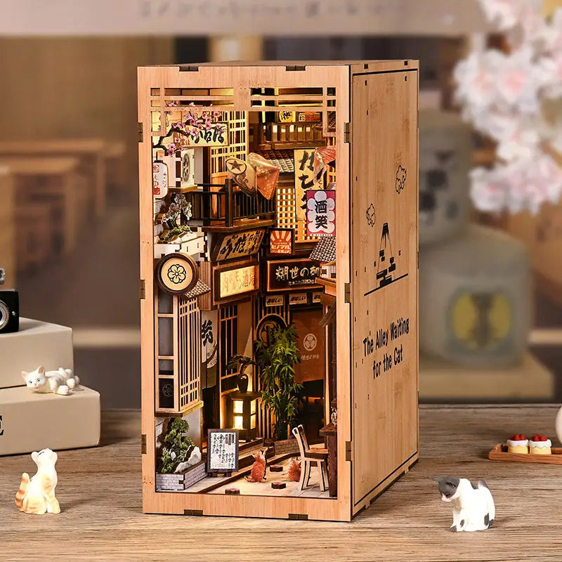 Alley cat cafe book nook diorama with tiny Japanese alley, signage, furniture, cat figurine