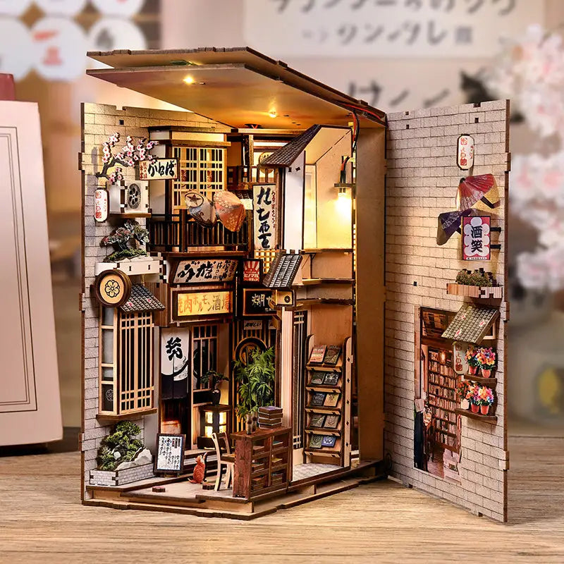 Alley cat cafe book nook diorama with tiny Japanese street scene