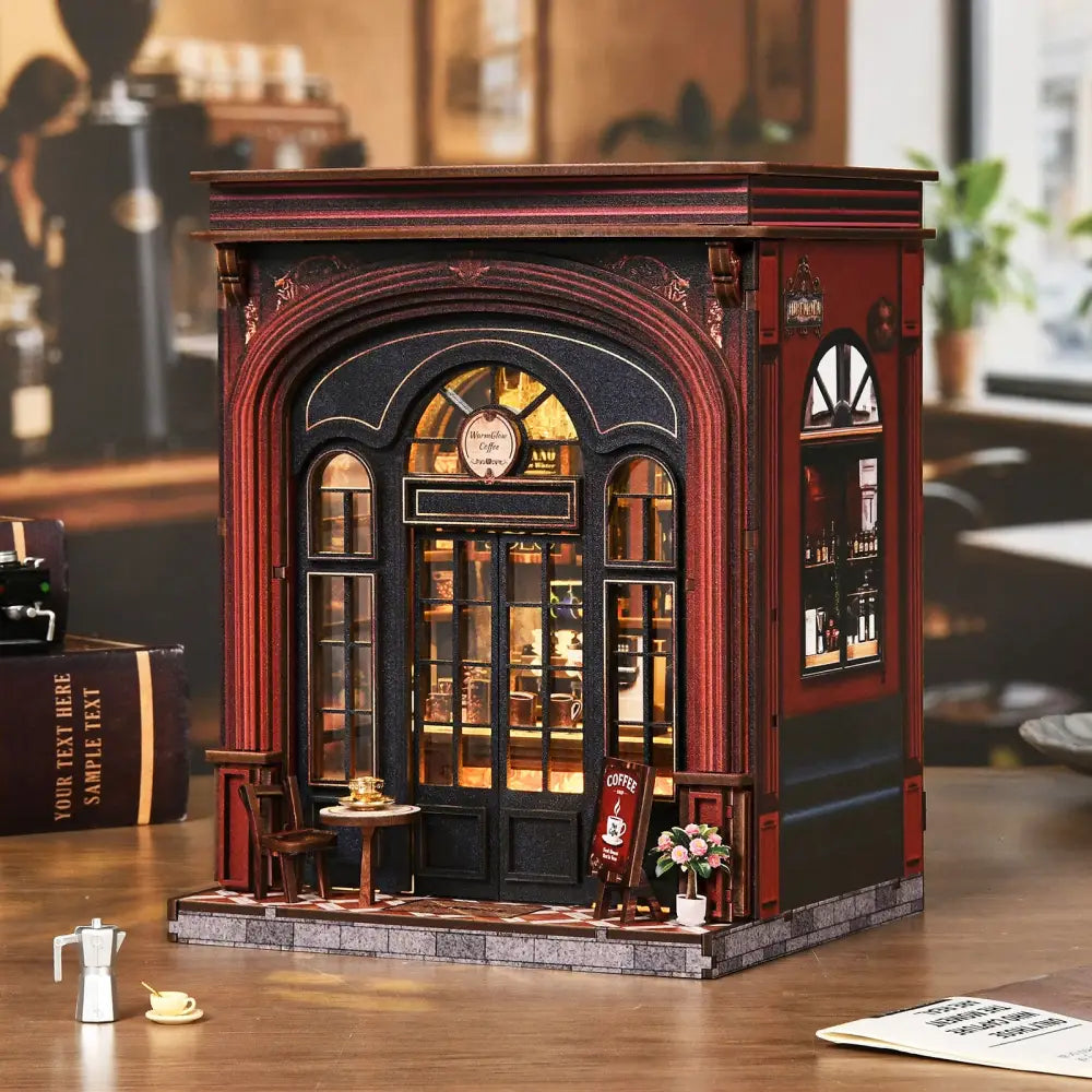 Miniature red and black warmglow coffee diy book nook with detailed arched windows and shelves displaying cups