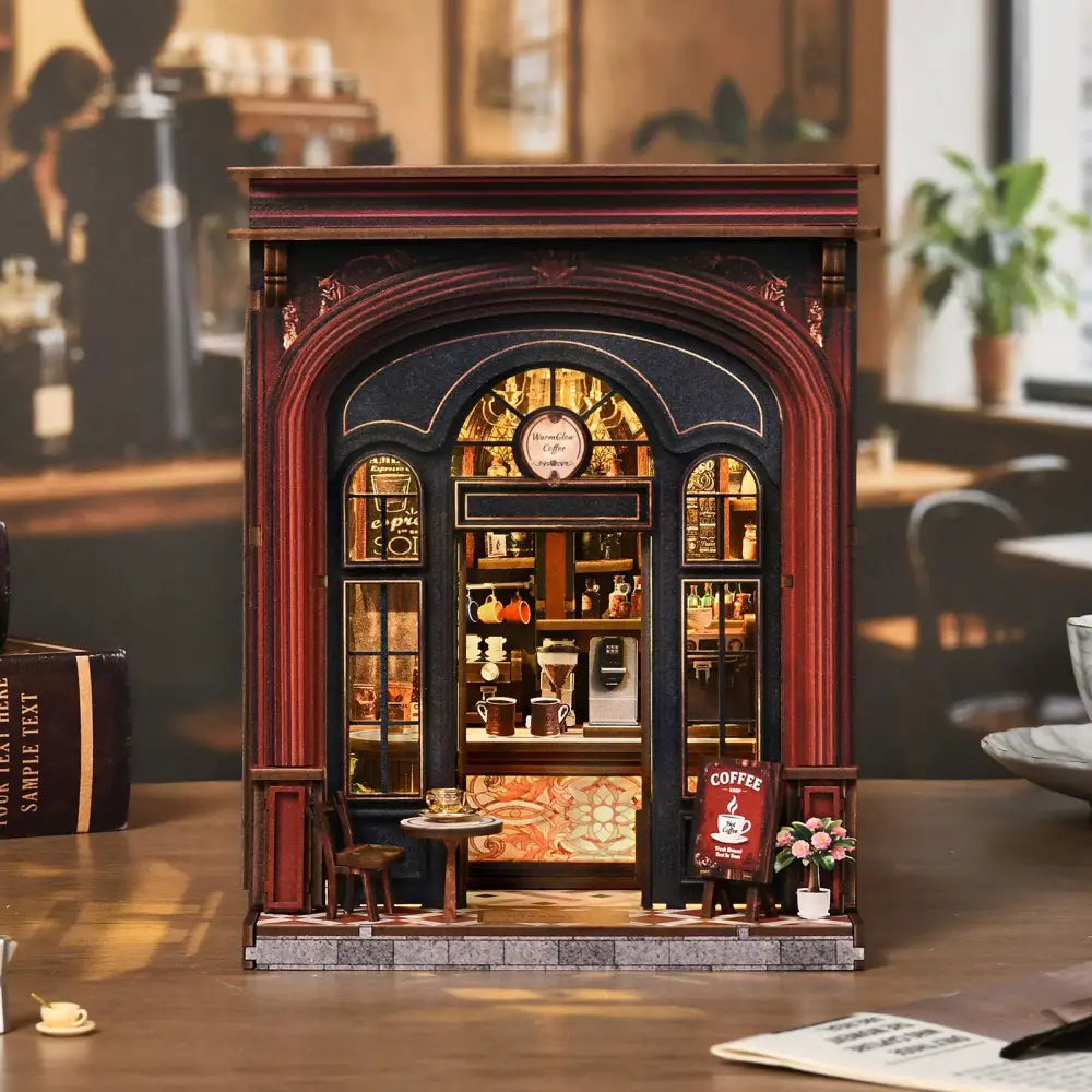 Detailed warmglow coffee diy book nook with dark red black facade arched window and tiny table chair setup