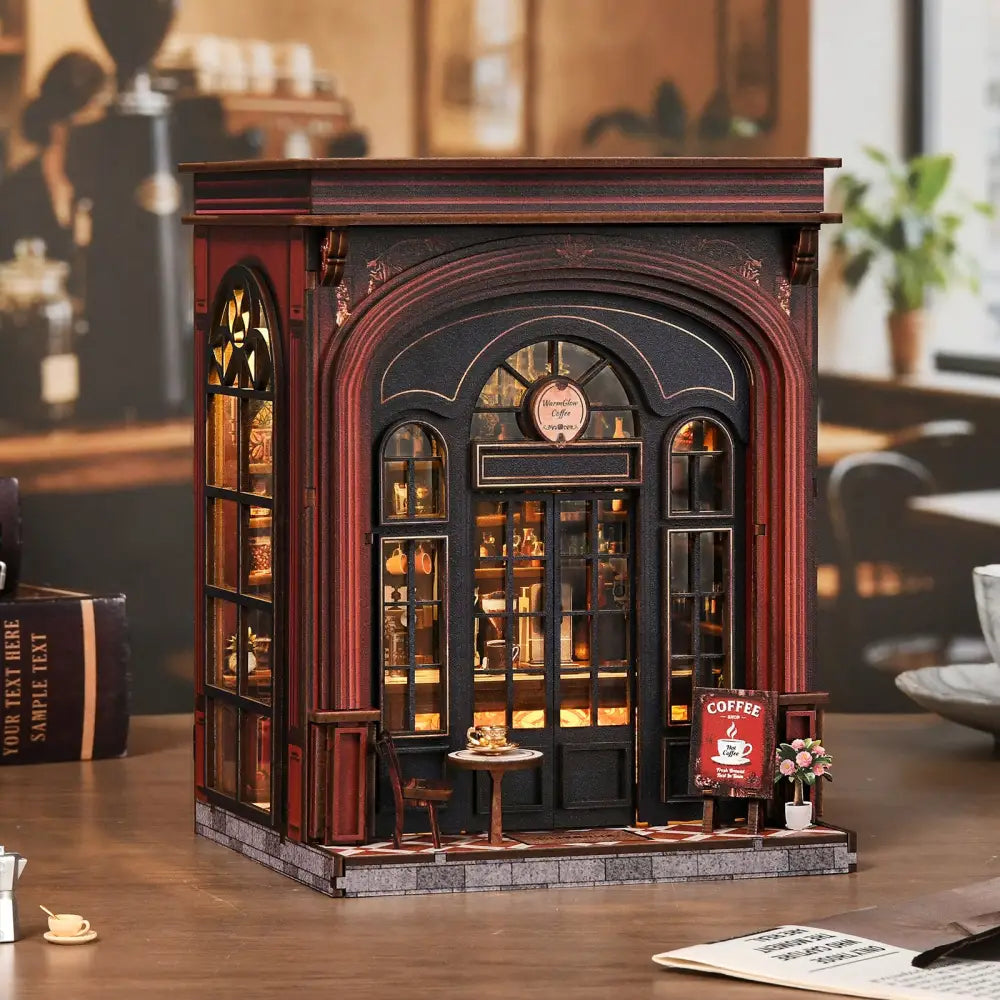 A detailed warmglow coffee diy book nook with black and deep red facade, glowing arched windows, and wooden trim